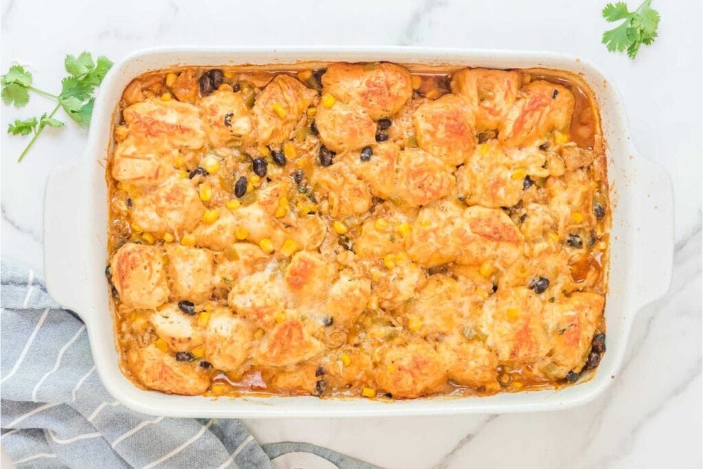 Chicken enchilada bake in a baking dish.