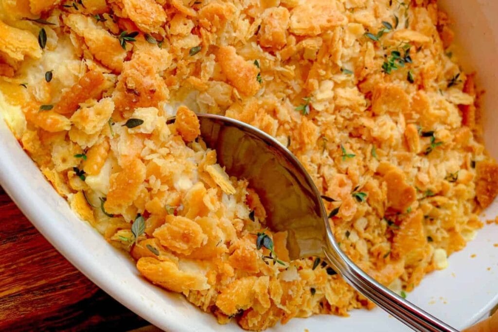 Chicken Ritz casserole scooped from a baking dish.