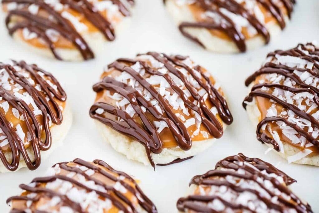 Coconut caramel cookies on parchment paper.