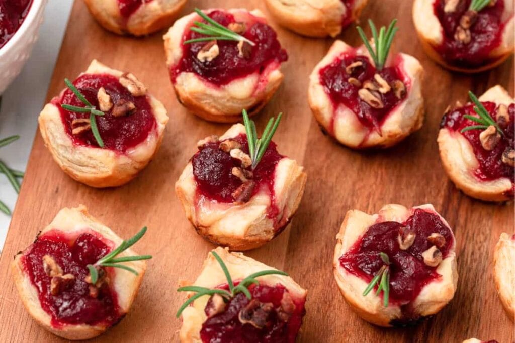 cranberry brie bites on board.