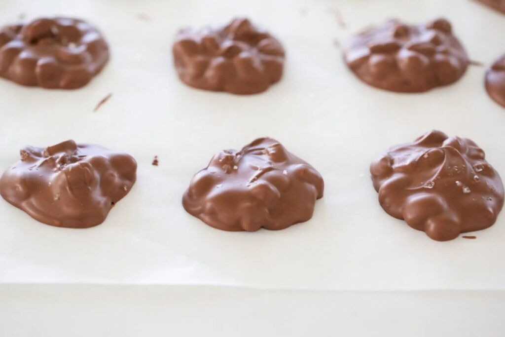 Crockpot candy set on parchment paper.