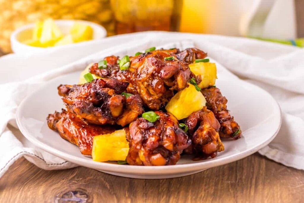 Crockpot Hawaiian chicken wings on a plate.