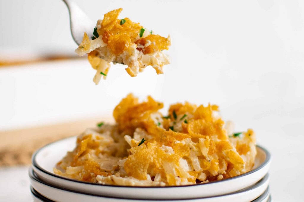 Funeral potatoes on a plate.