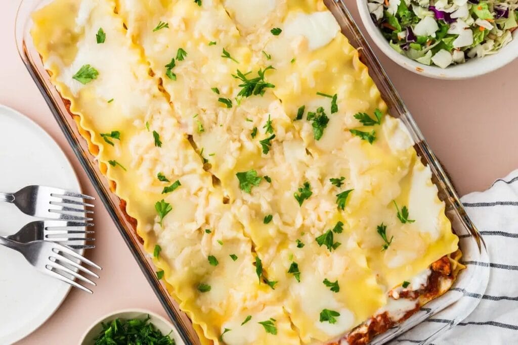 Layered ground turkey lasagna in a baking dish.