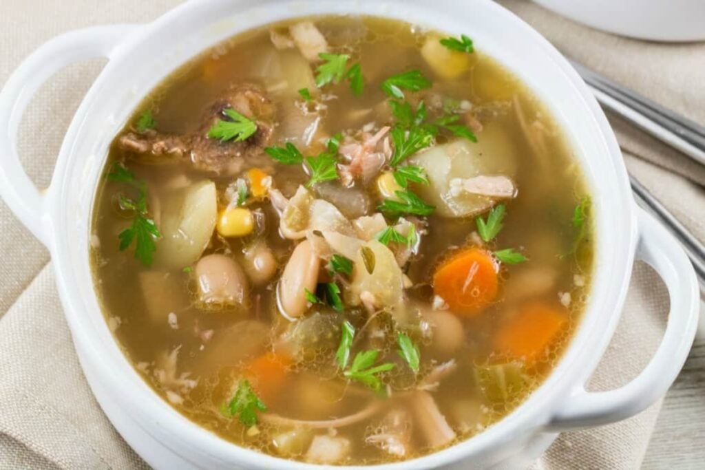 Ham bone soup in a bowl.