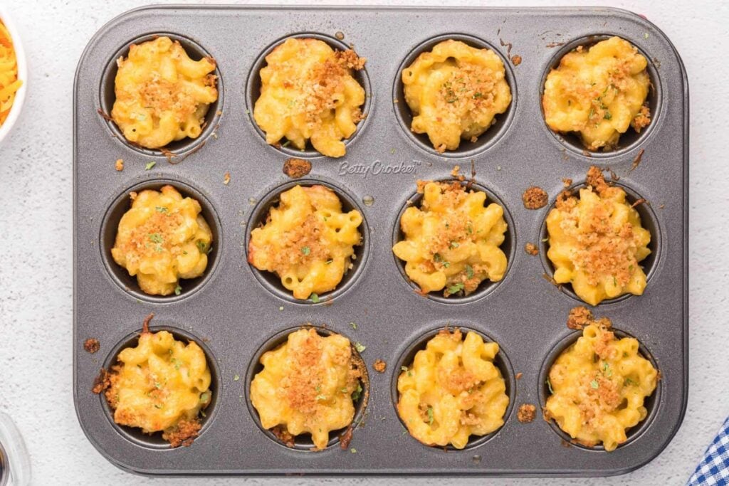 Top view of homemade mac and cheese cups in a muffin tin.
