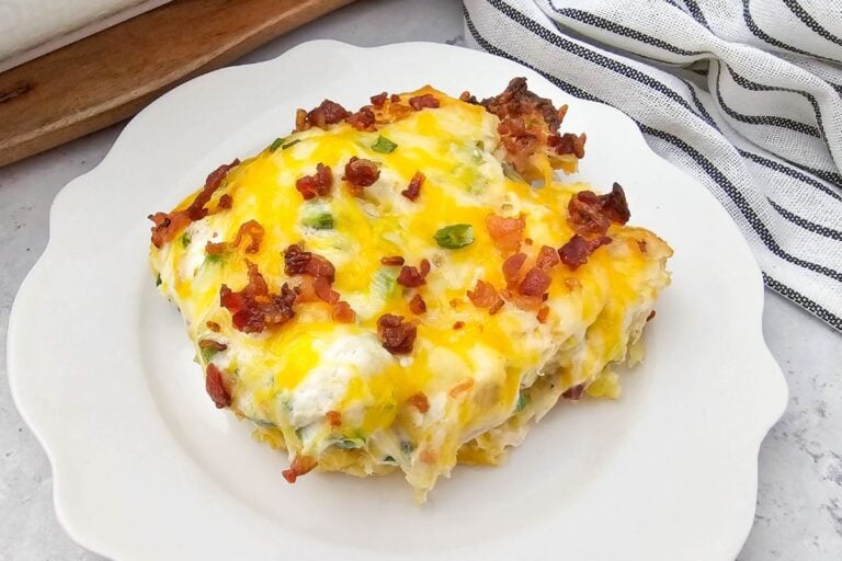 Jalapeno popper chicken casserole on while plate.