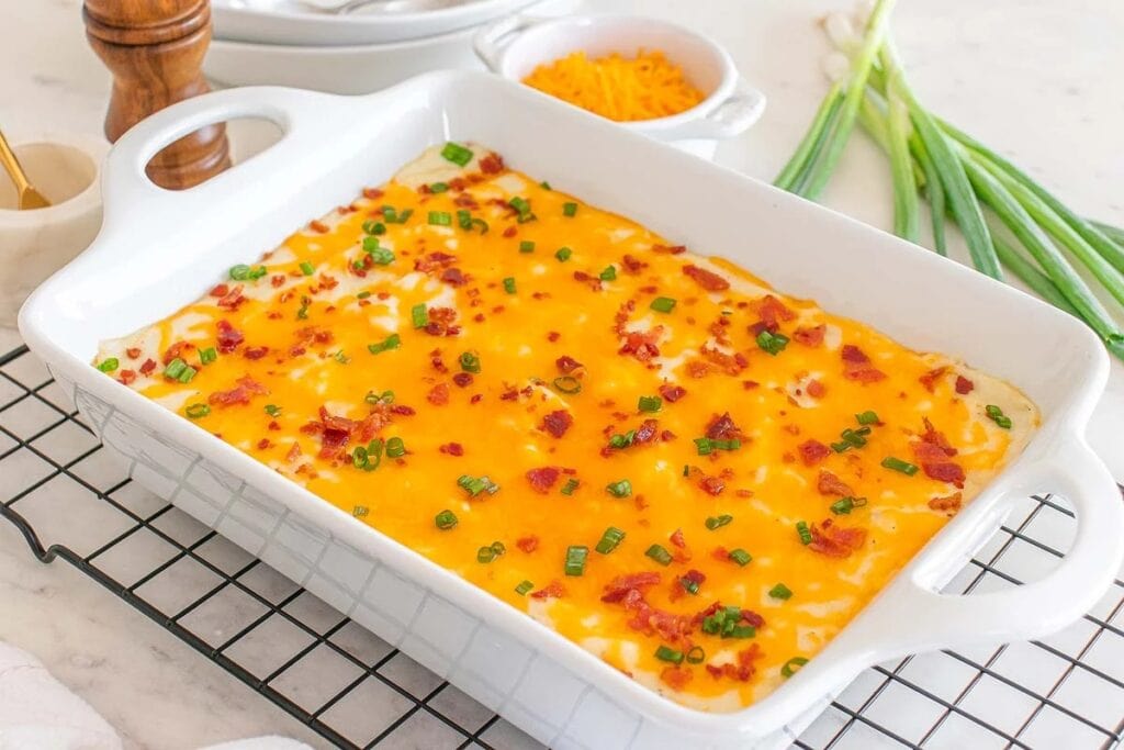 Loaded mashed potato casserole in a baking dish.