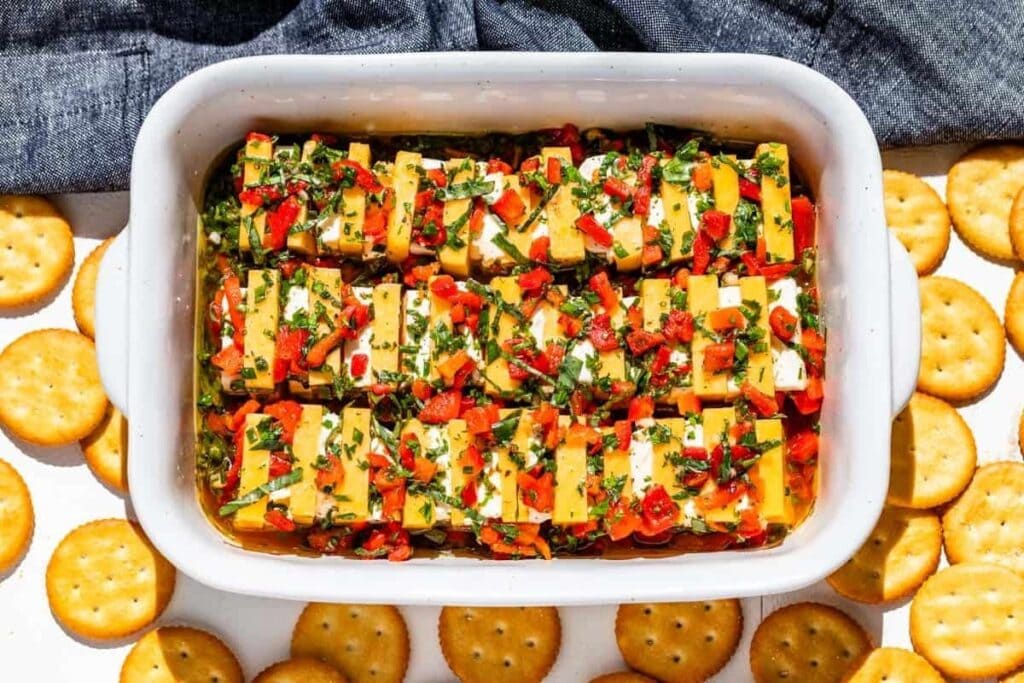 Marinated cheese in a baking dish.