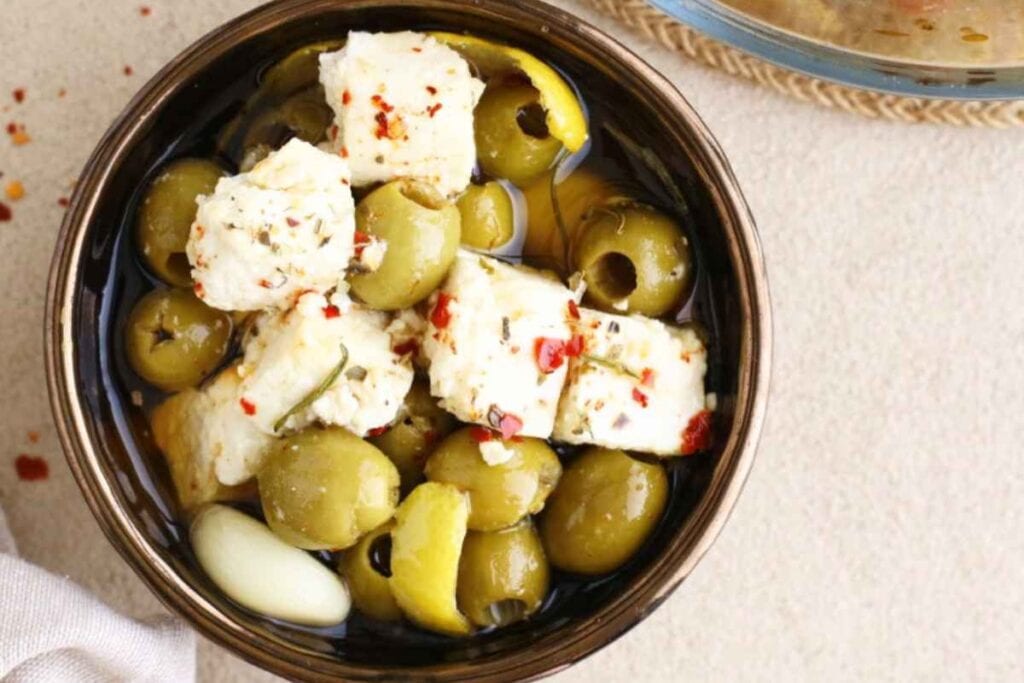 Marinated olives and feta in a bowl.