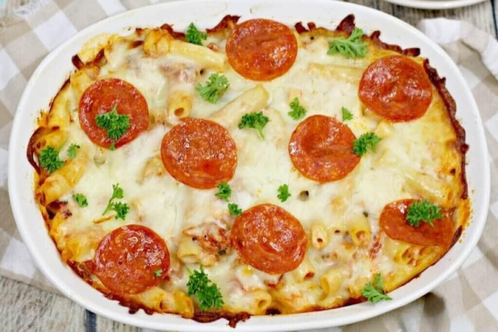 Top view of pizza pasta bake in a baking dish.