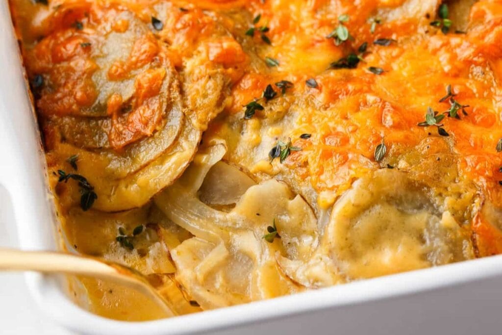 Close-up of potatoes au gratin in a baking dish.