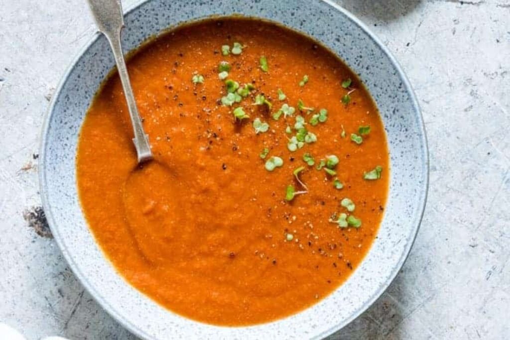 Slow cooker curried tomato soup in a bowl.