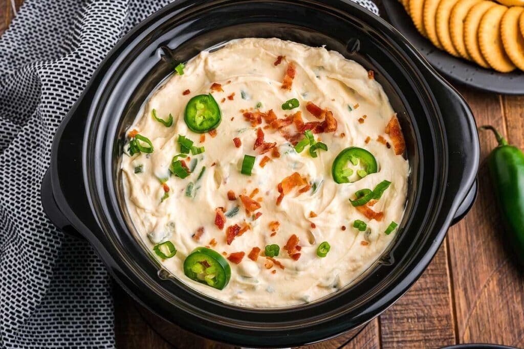 Jalapeño popper dip in a slow cooker.
