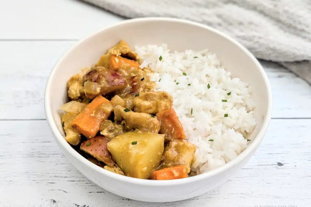 Bowl of slow cooker japanese chicken curry with rice.