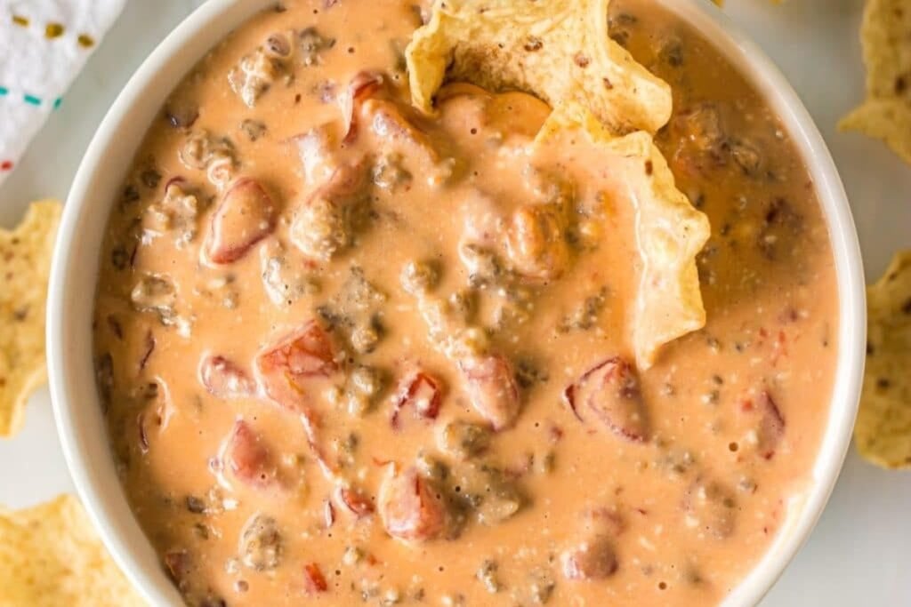Slow cooker sausage cheese dip in a bowl.