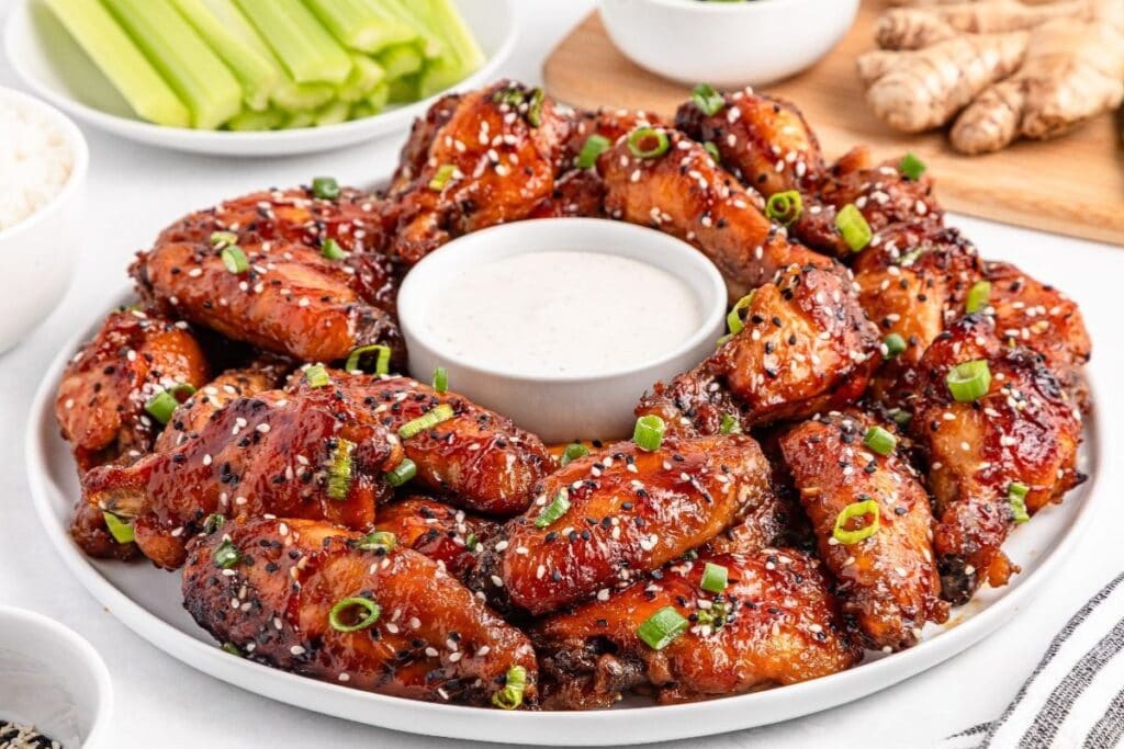 Teriyaki wings on a plate.
