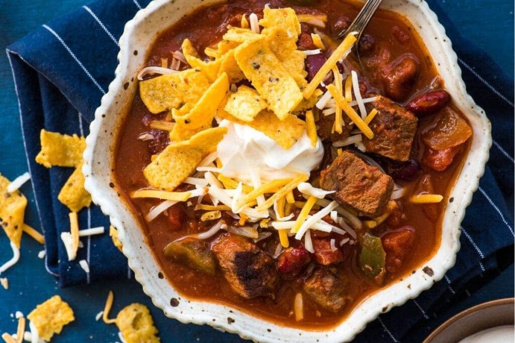 Top view of steak chili in a bowl.