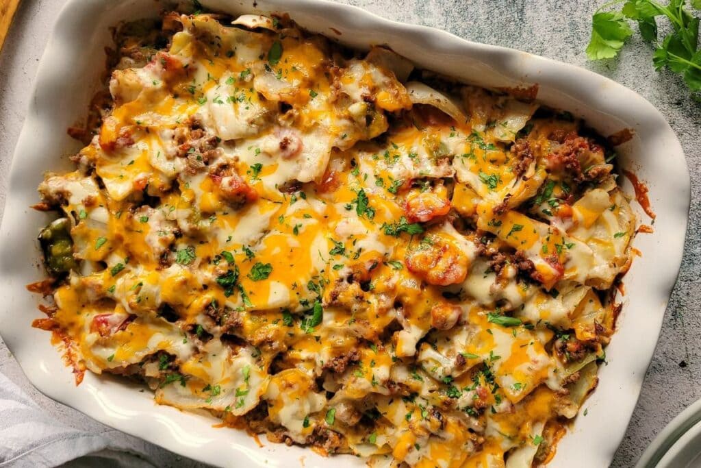 Overhead shot of cabbage casserole with ground beef and melted cheese.