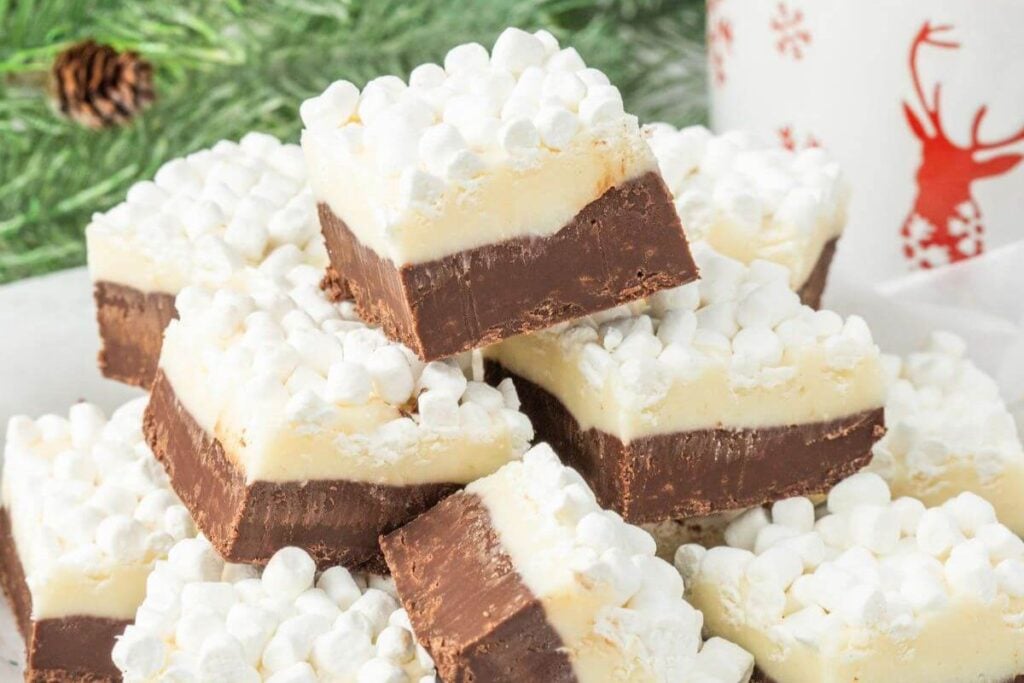 Two-layer hot chocolate fudge squares topped with marshmallows.
