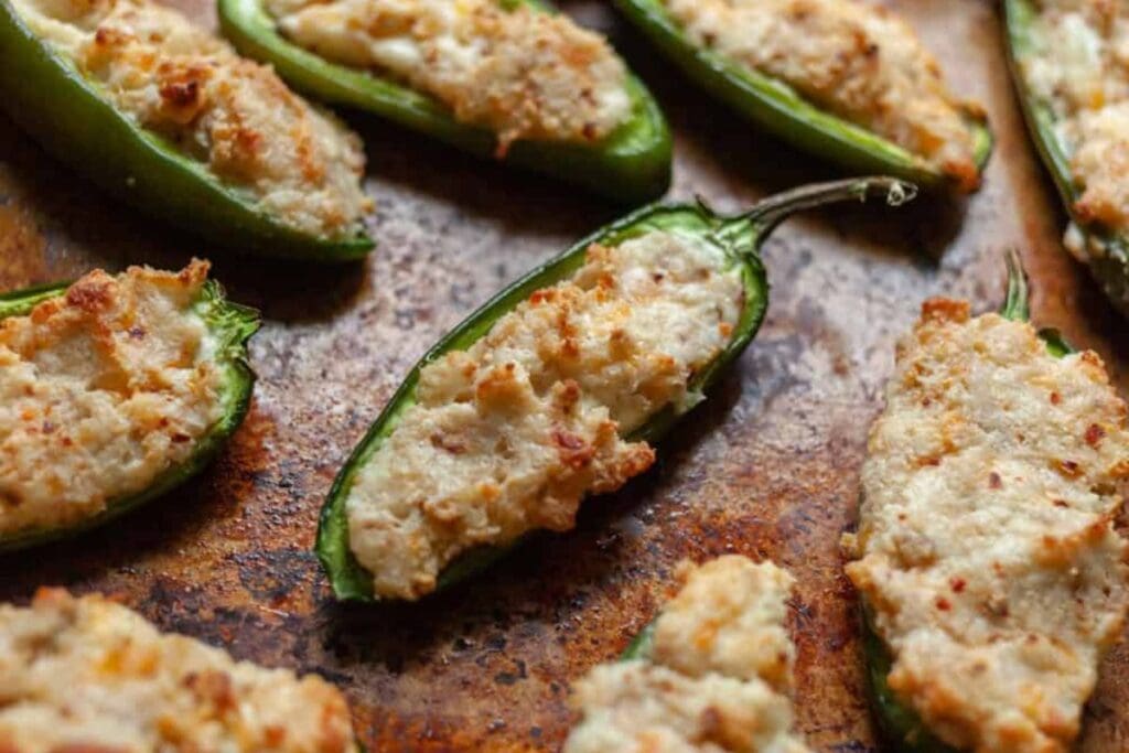 Baked jalapeño poppers filled with a creamy, cheesy filling.