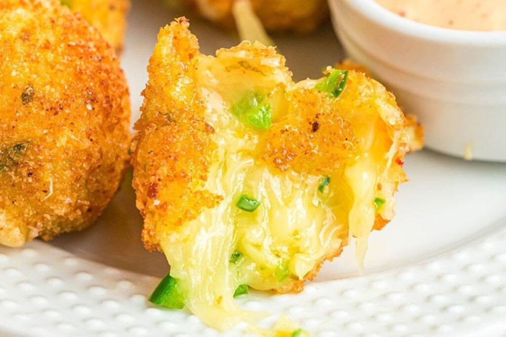 Fried cheese bite with jalapeños and a creamy dipping sauce.