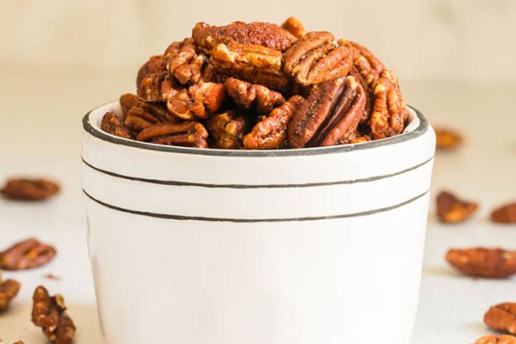 A close up shot of spiced pecans.