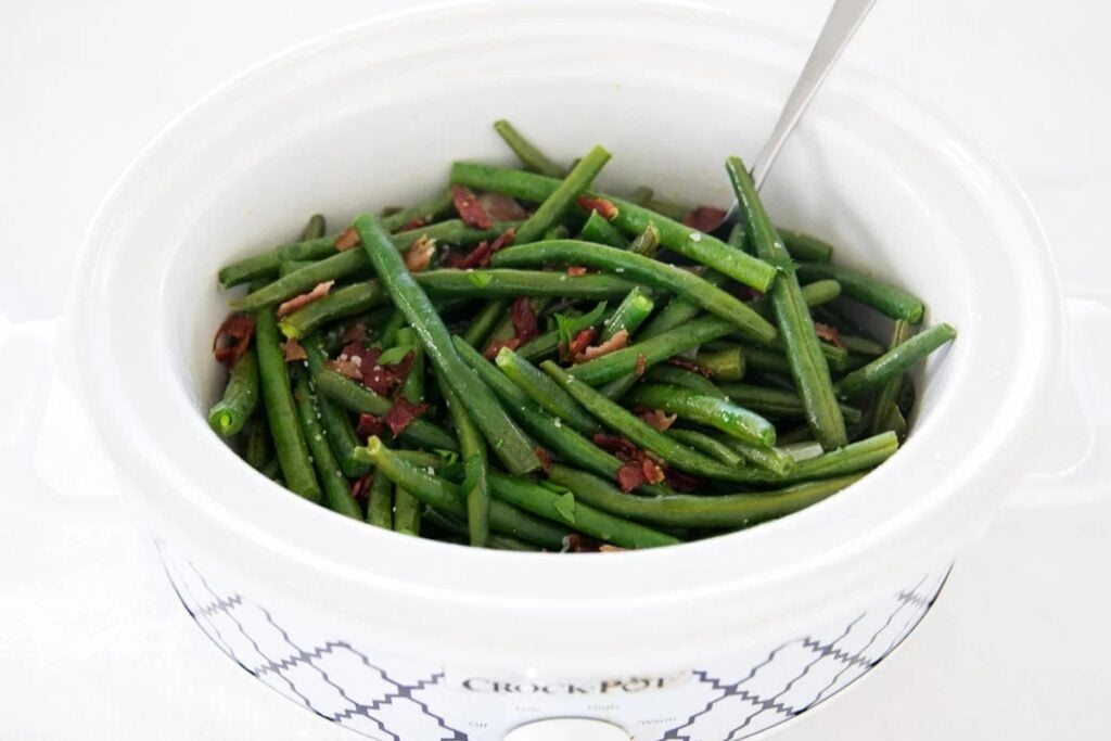 Green beans with bacon in a crockpot.