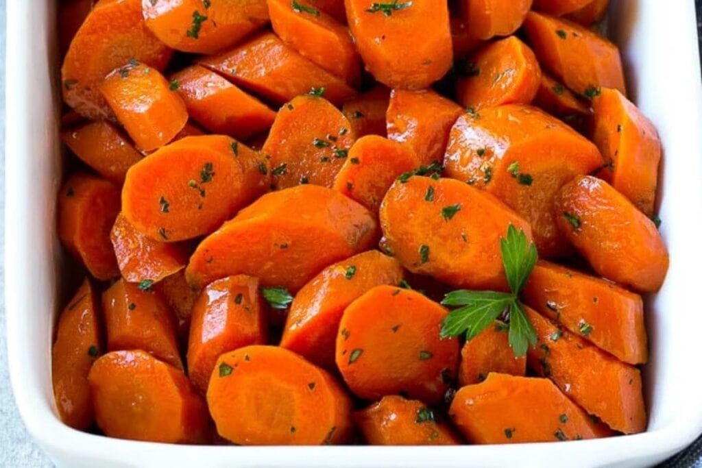 Slow cooker glazed carrots in a baking dish.