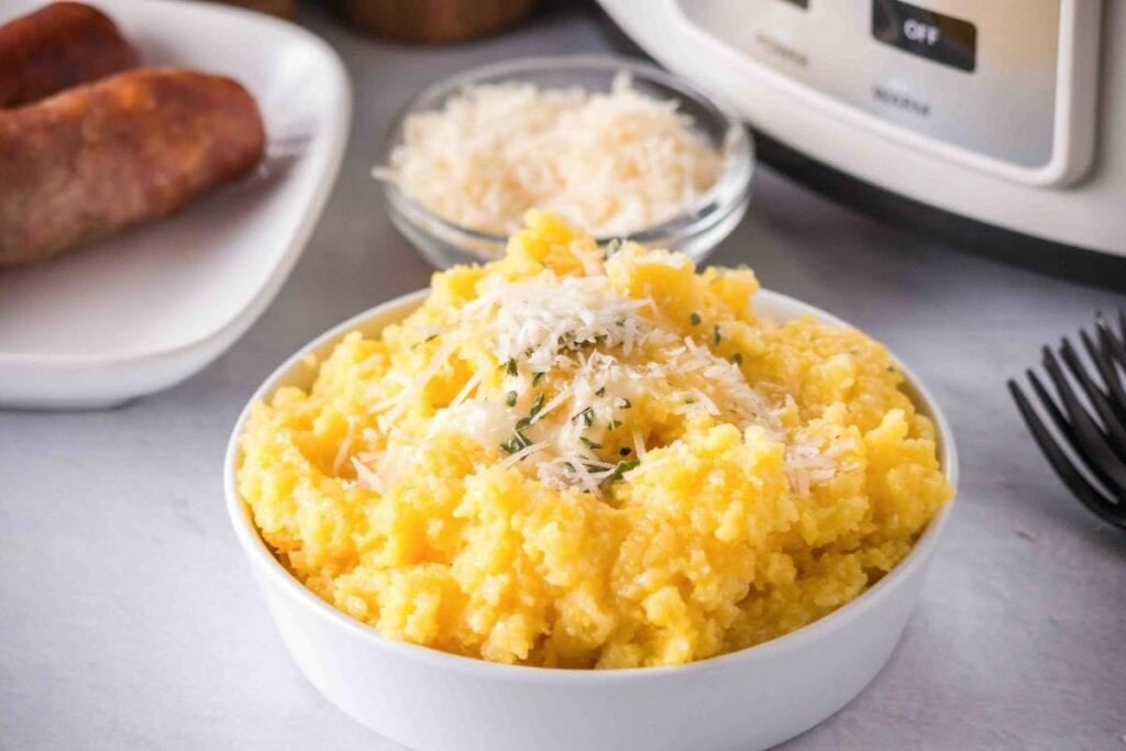 Slow cooker polenta in a white bowl.