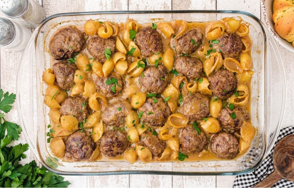 Swedish meatball pasta bake in a clear baking dish.