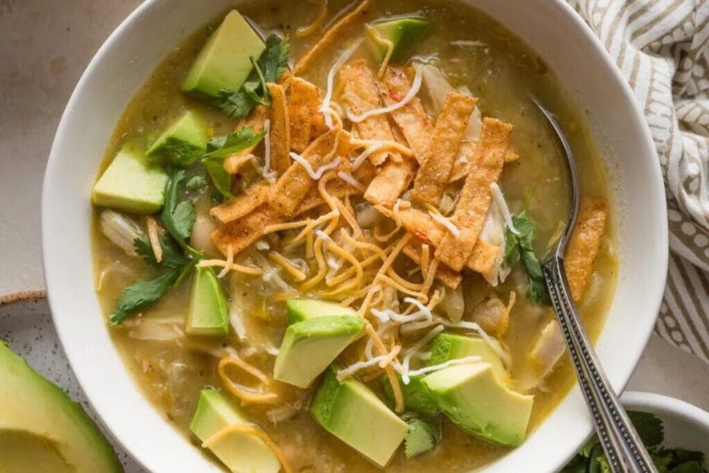 White bean chicken chili served in a bowl with a spoon.