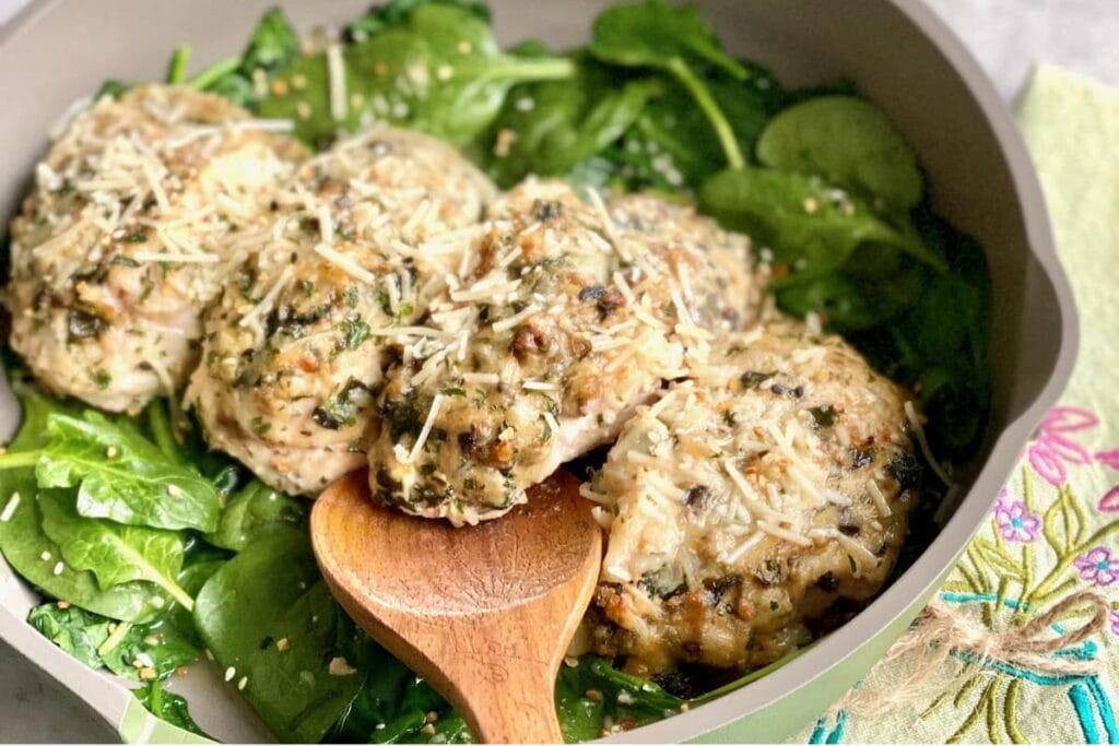 A close up shot of chicken stuffed chicken breasts.