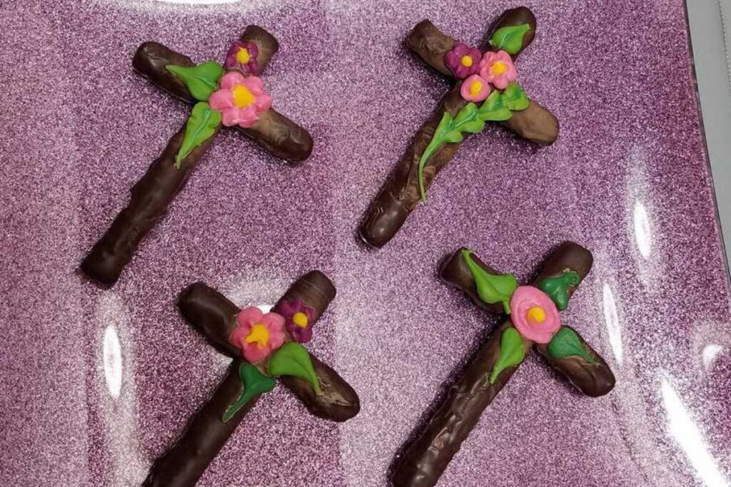A close up shot of chocolate covered cross pretzels.