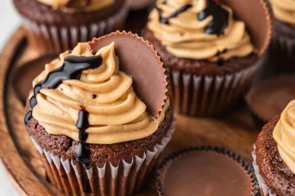 A close up shot of chocolate peanut butter cupcakes.