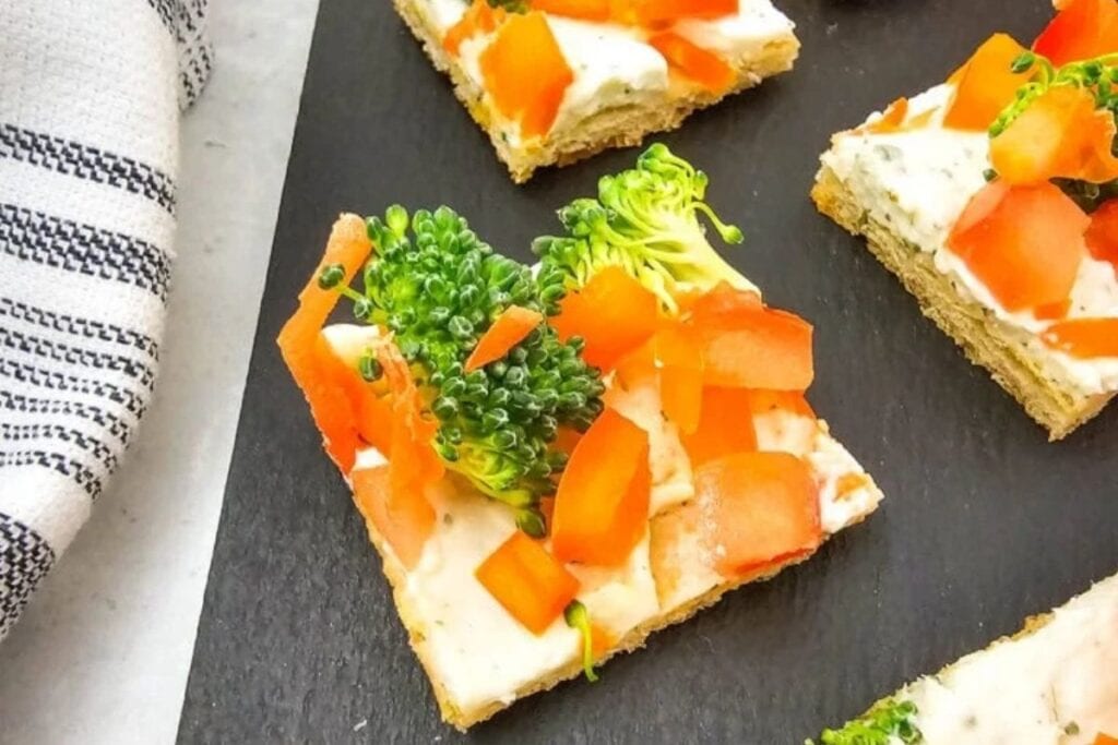 A close up shot of crescent roll veggie pizza.