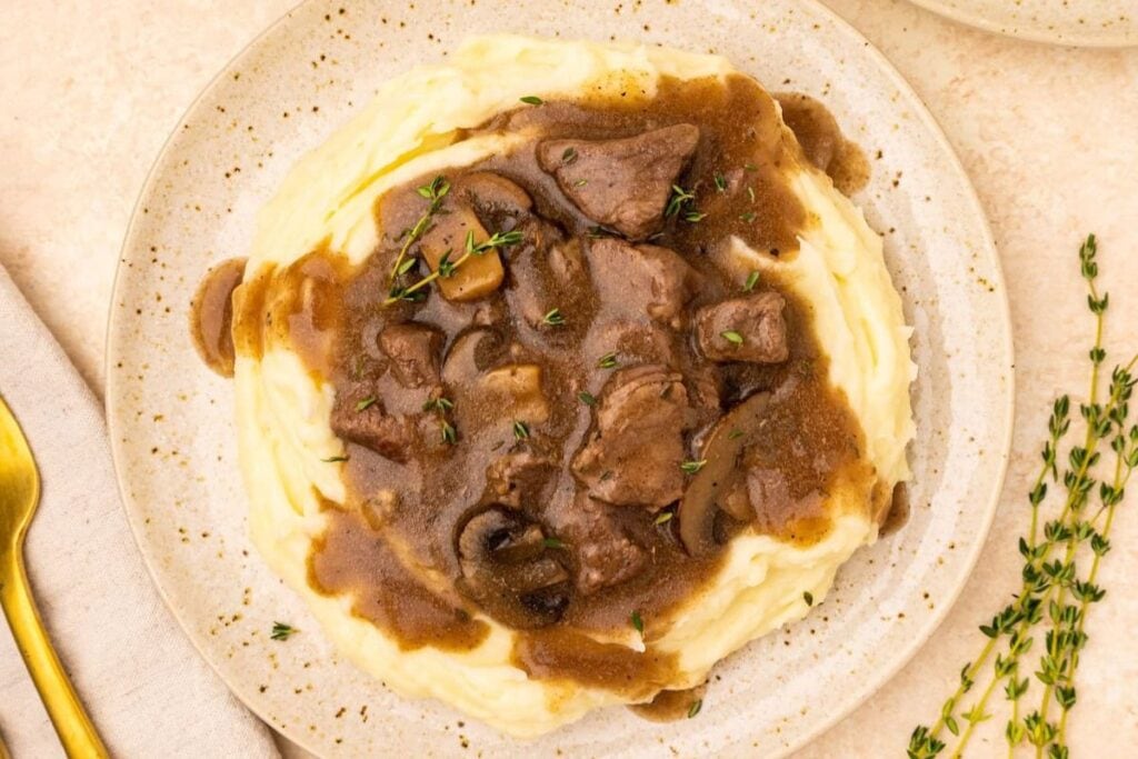A close up shot of beef tips and gravy.