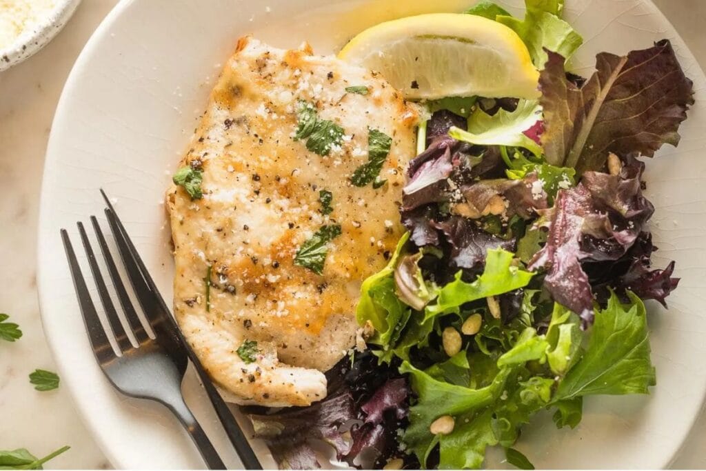 A close up shot of Italian dressing chicken.