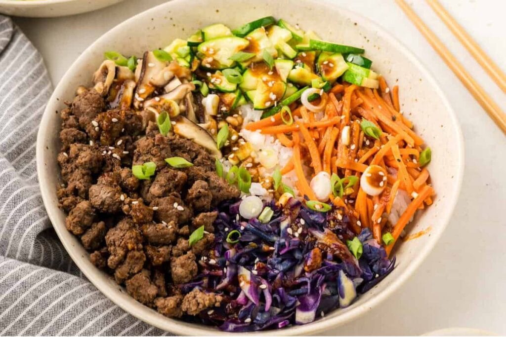 A close up shot of korean beef bowls.