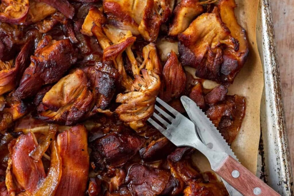 A close up shot of bbq chicken thighs.