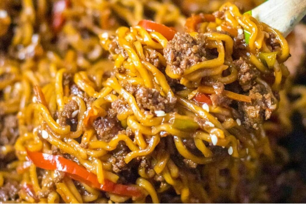 A close up shot of beef and ramen noodles.
