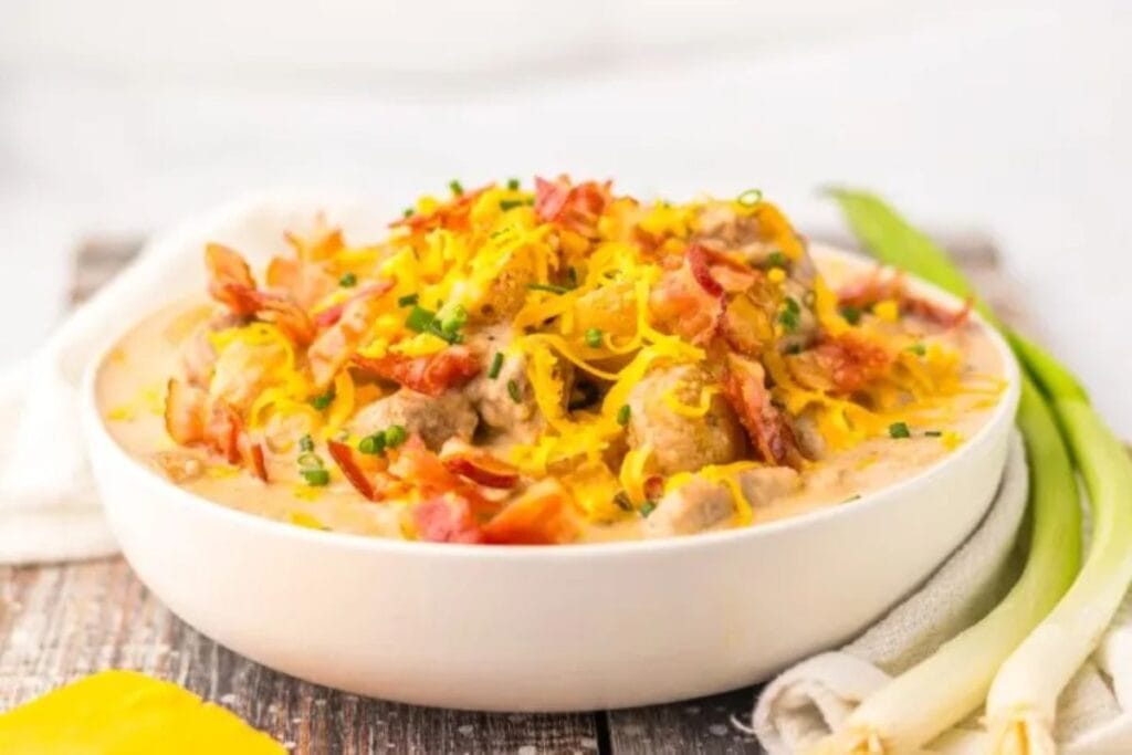 A close up shot of slow cooker steak and potato soup.