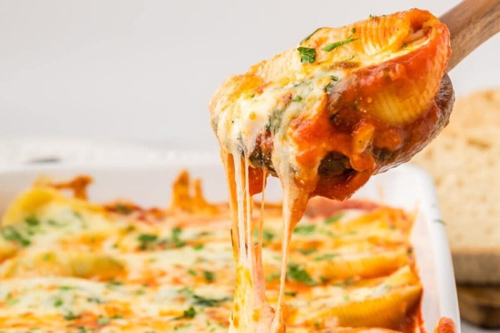 A close up shot of ricotta stuffed shells.