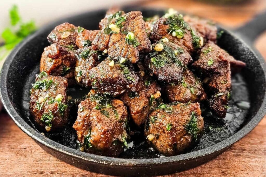 Air fryer steak bites on a plate.