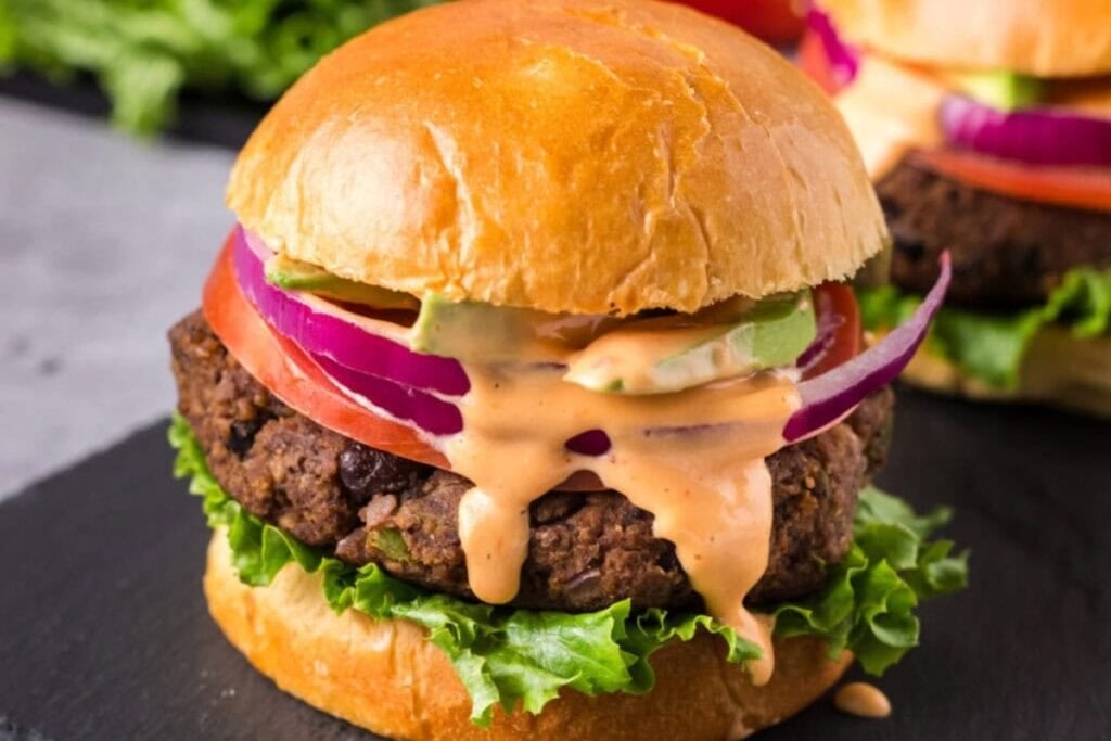 Black bean burger on a stoneware plate.