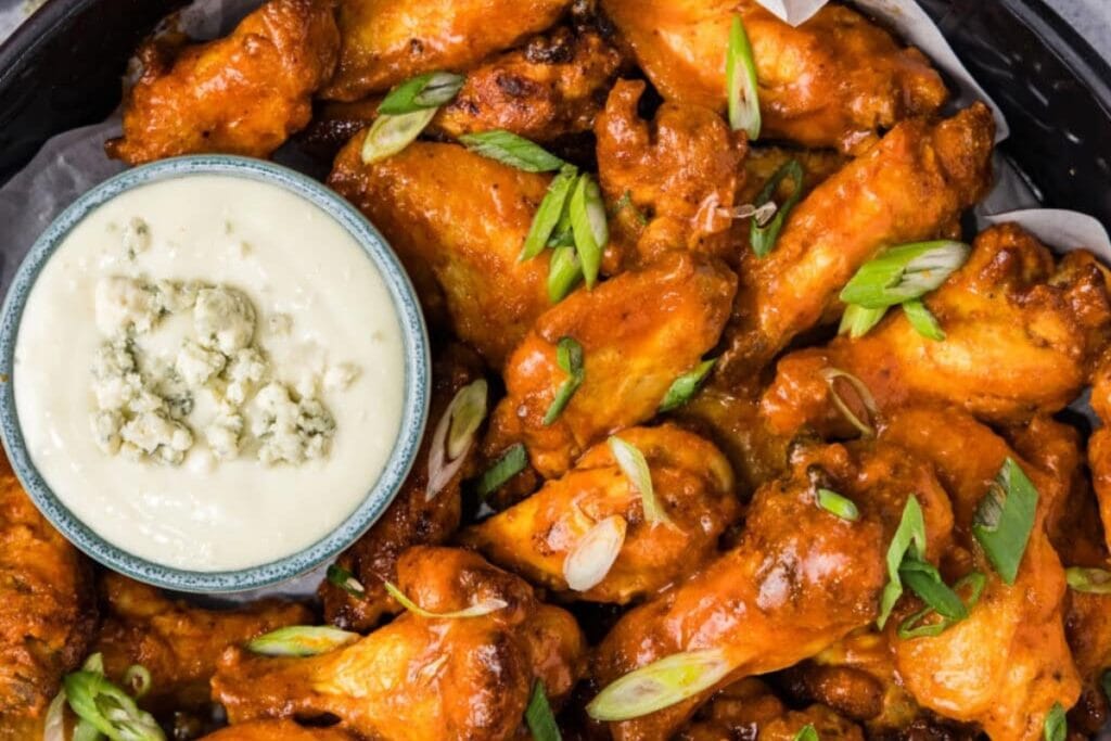Buffalo chicken wings in a pot.