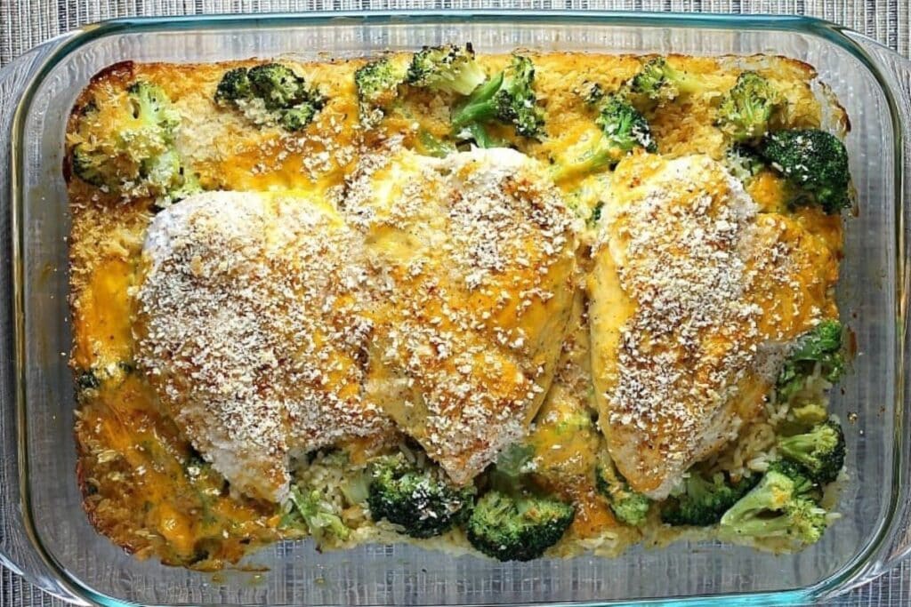 Cheesy chicken broccoli and rice casserole in a baking dish.