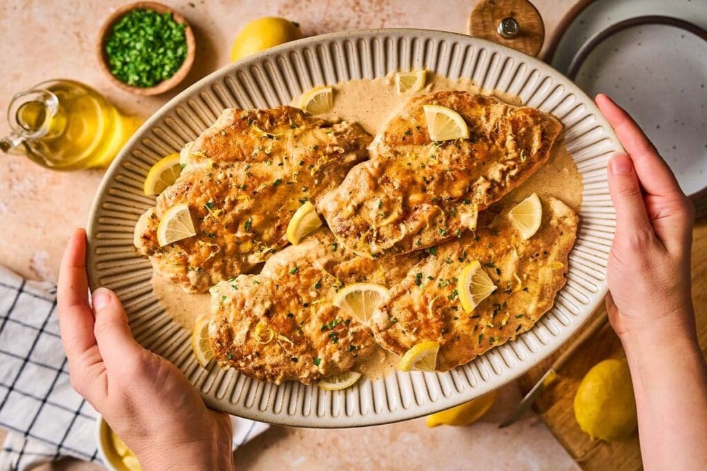 Chicken limone on a plate.