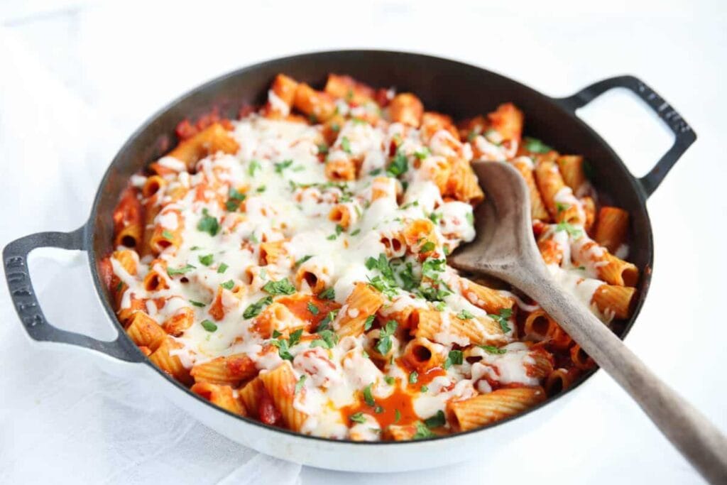 Chicken Parmesan pasta in a skillet.