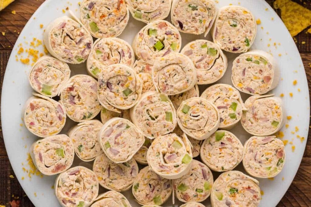 Chicken pinwheels on a plate.